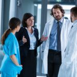 Businesswoman interacting with doctors