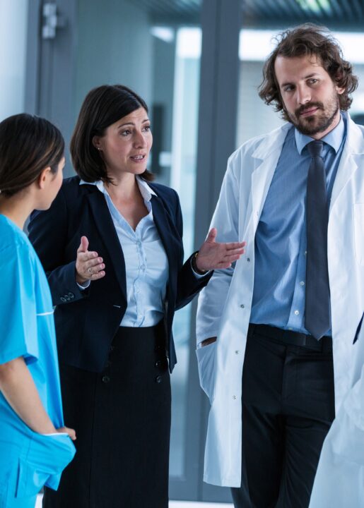 Businesswoman interacting with doctors